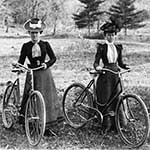 Two Victorian era women on bicycles