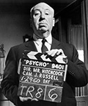 Alfred Hitchcock with Psycho Clapboard 