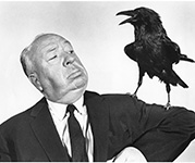 Alfred Hitchcock with Bird on his arm 