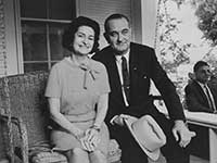 Lyndon B Johnson with his wife on his front porch