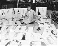 Edith Head surrounded by her sketches